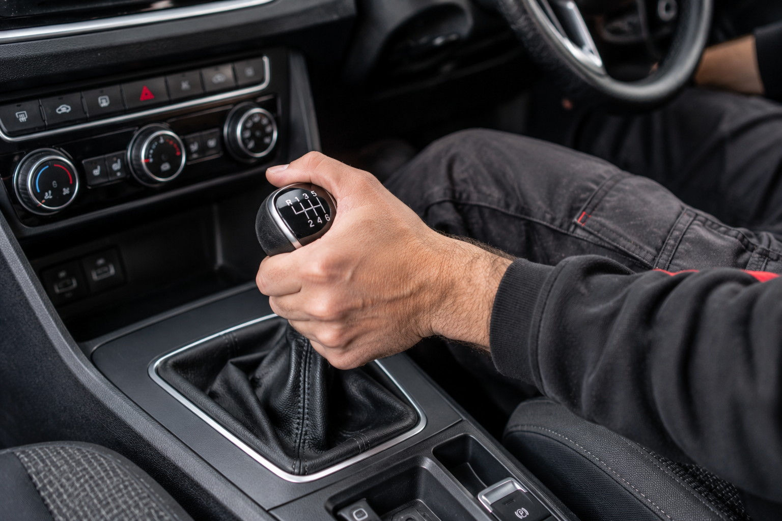 Manual gear shift in a modern car interior